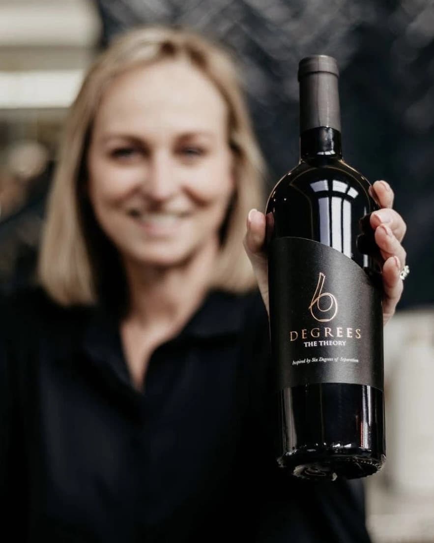 Pouring a glass of 6 Degrees wine